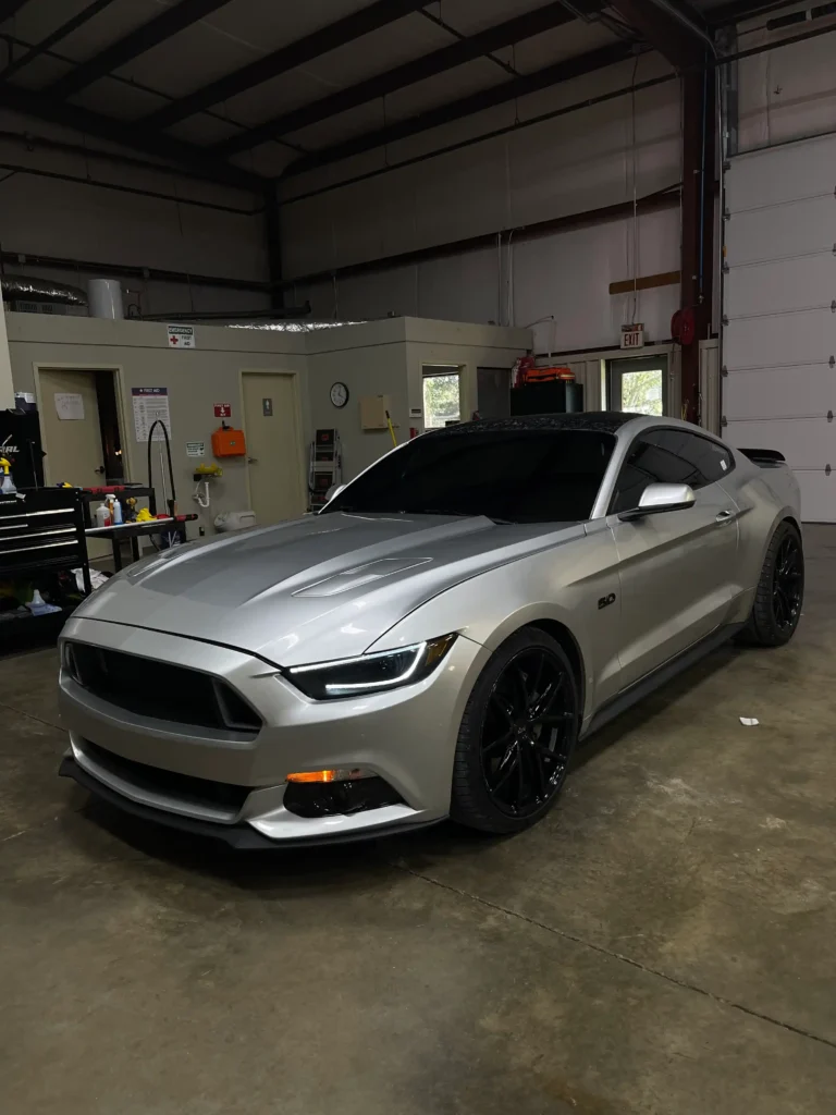 Installing window tint on a classic car in Nashville, TN by Shade Shoppe.