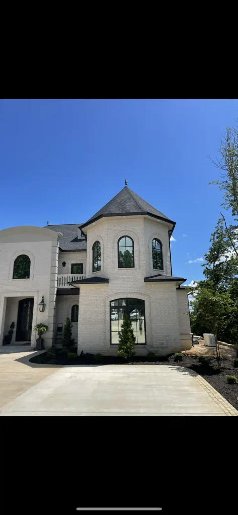 Applying ceramic window tint to a house in Nashville by Shade Shoppe